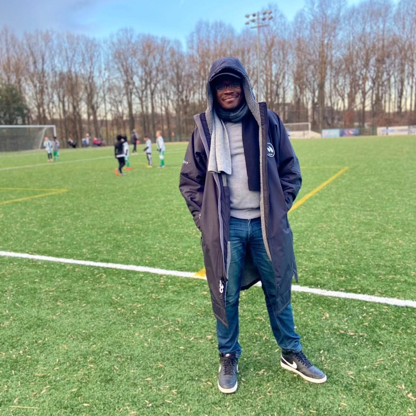 Dad on soccer sidelines wearing all-weather aull-dry jacket
